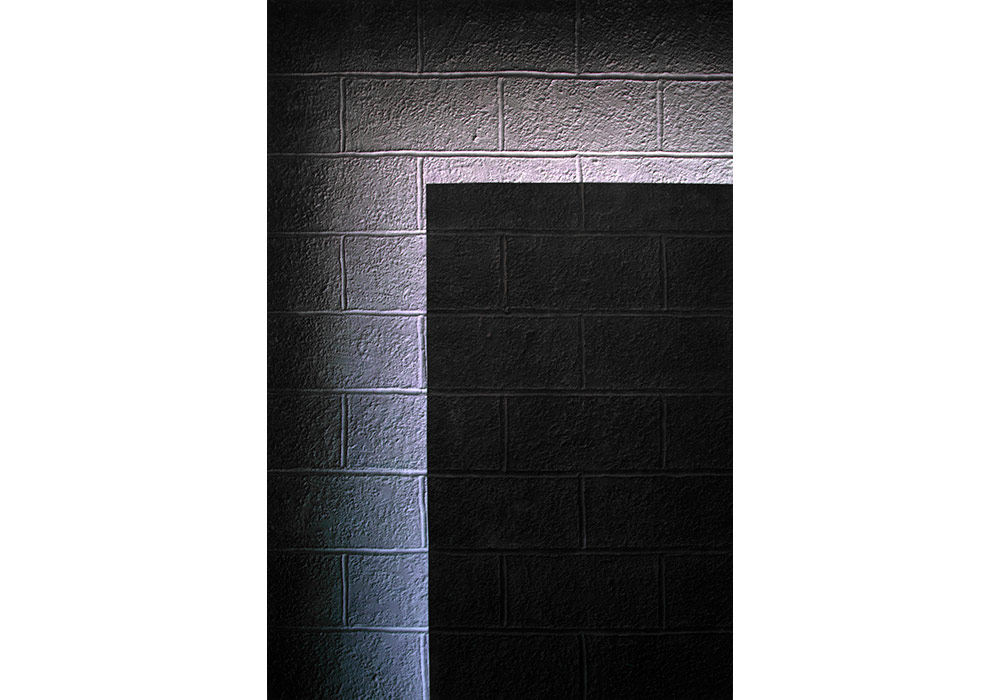 A cinderblock wall that wants to shine