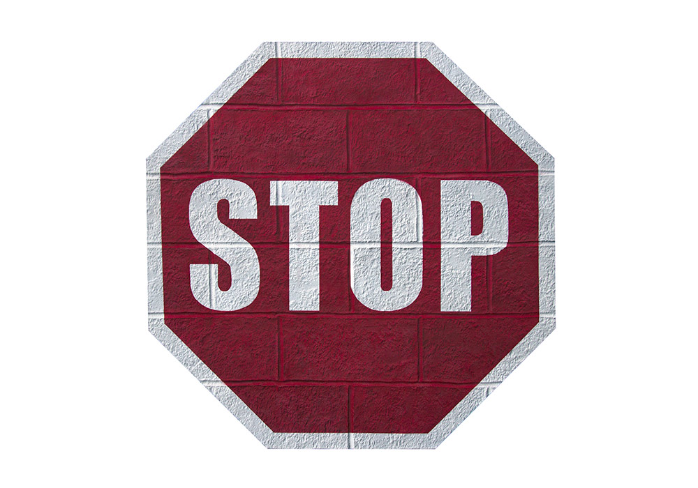 A Cinder block wall that wants to be a STOP sign