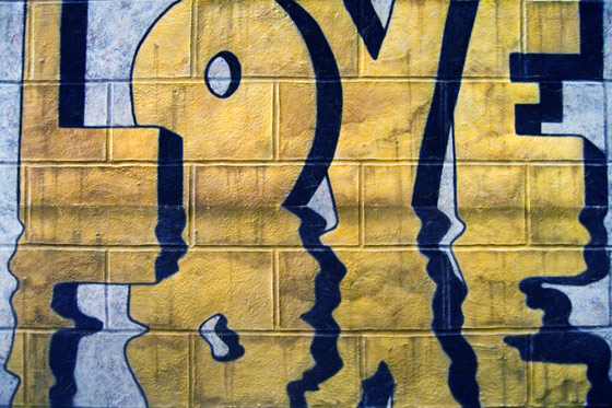 “LOVE, reflected” by graffiti artist Nolan Haan, who specializes in fool-the-eye art writing on walls. Paintings are acrylic on silk.